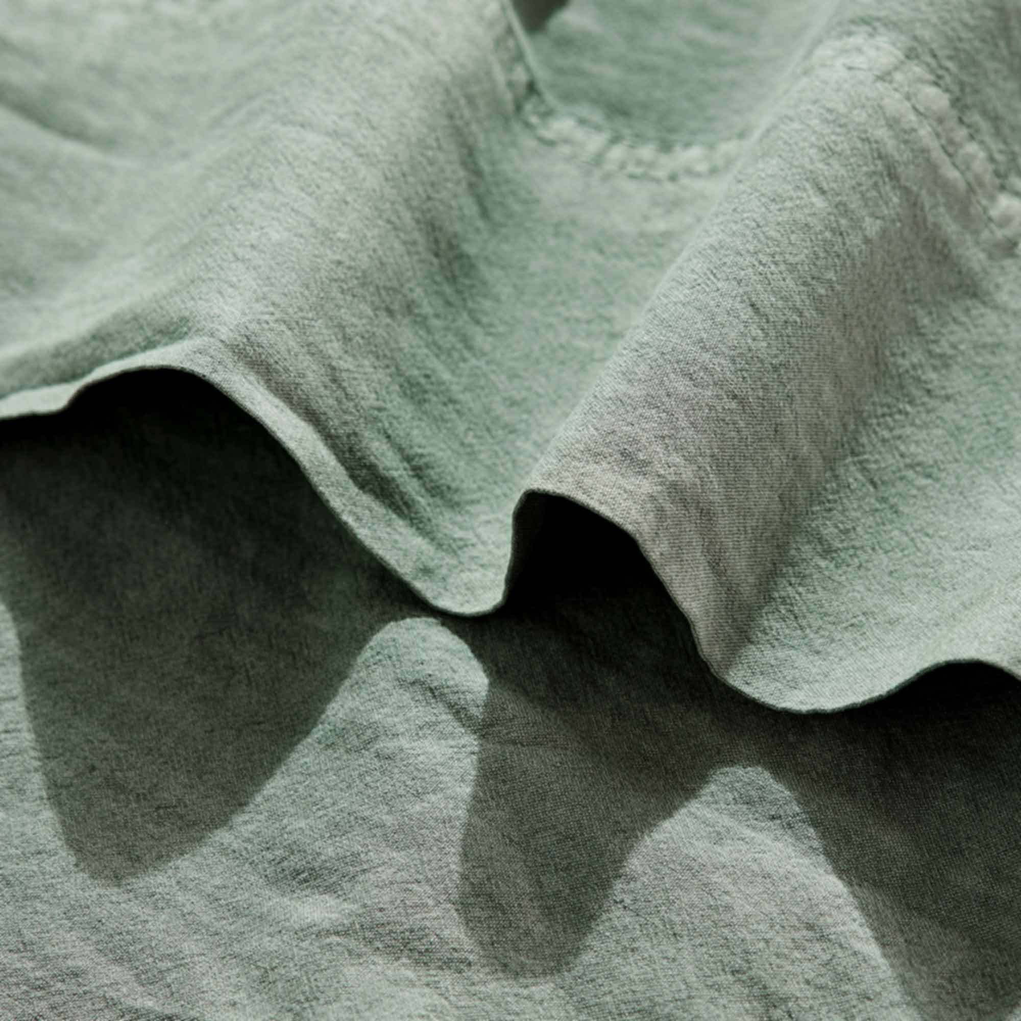Royal Doulton Nelson Sage sheet fabric close-up with a folded hem