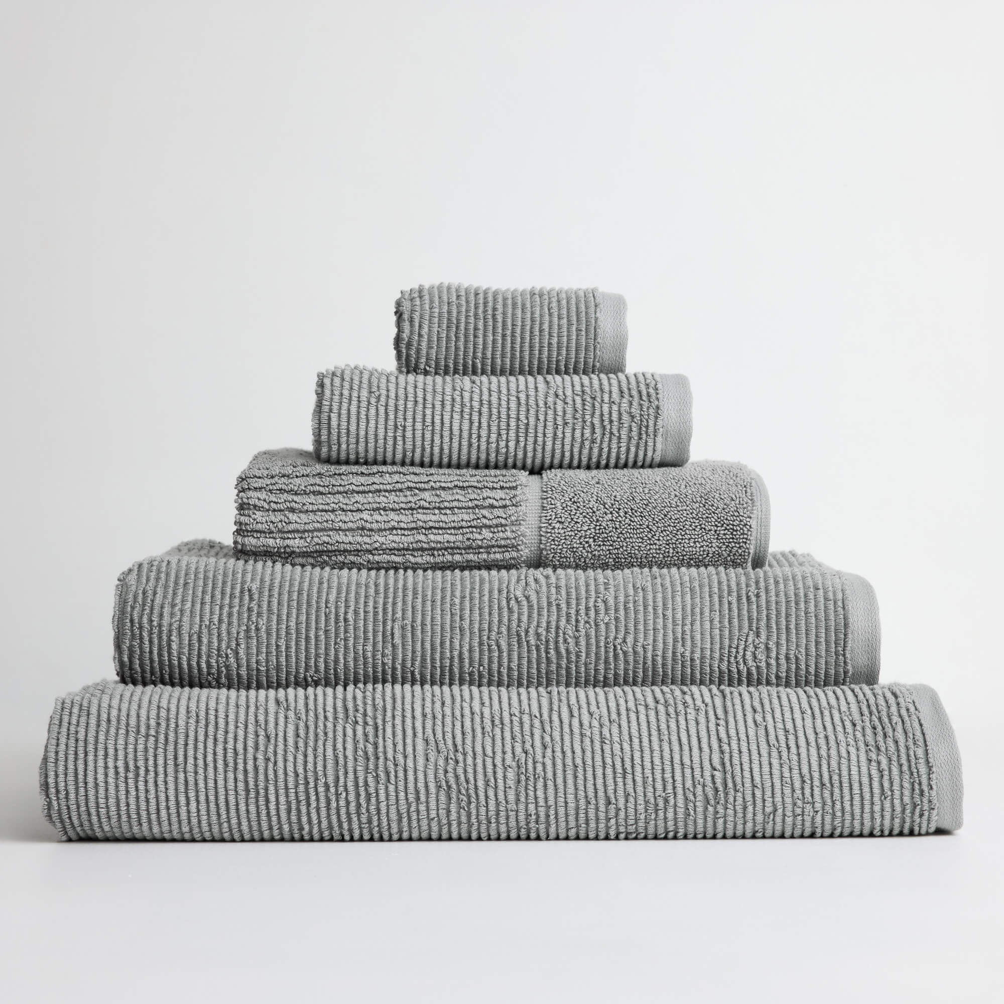 Royal Doulton Eden Steel grey towel set stacked on a white background