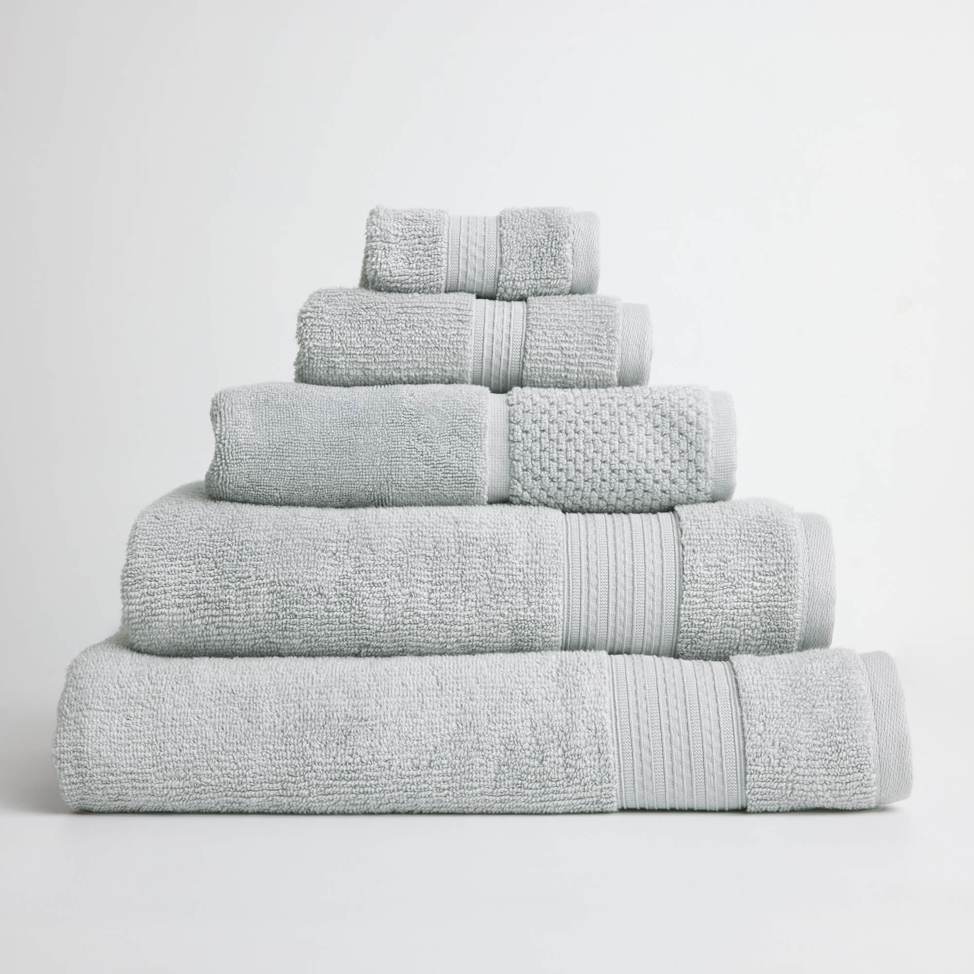 Royal Doulton Harlow Cloud light grey towel set stacked on a white background