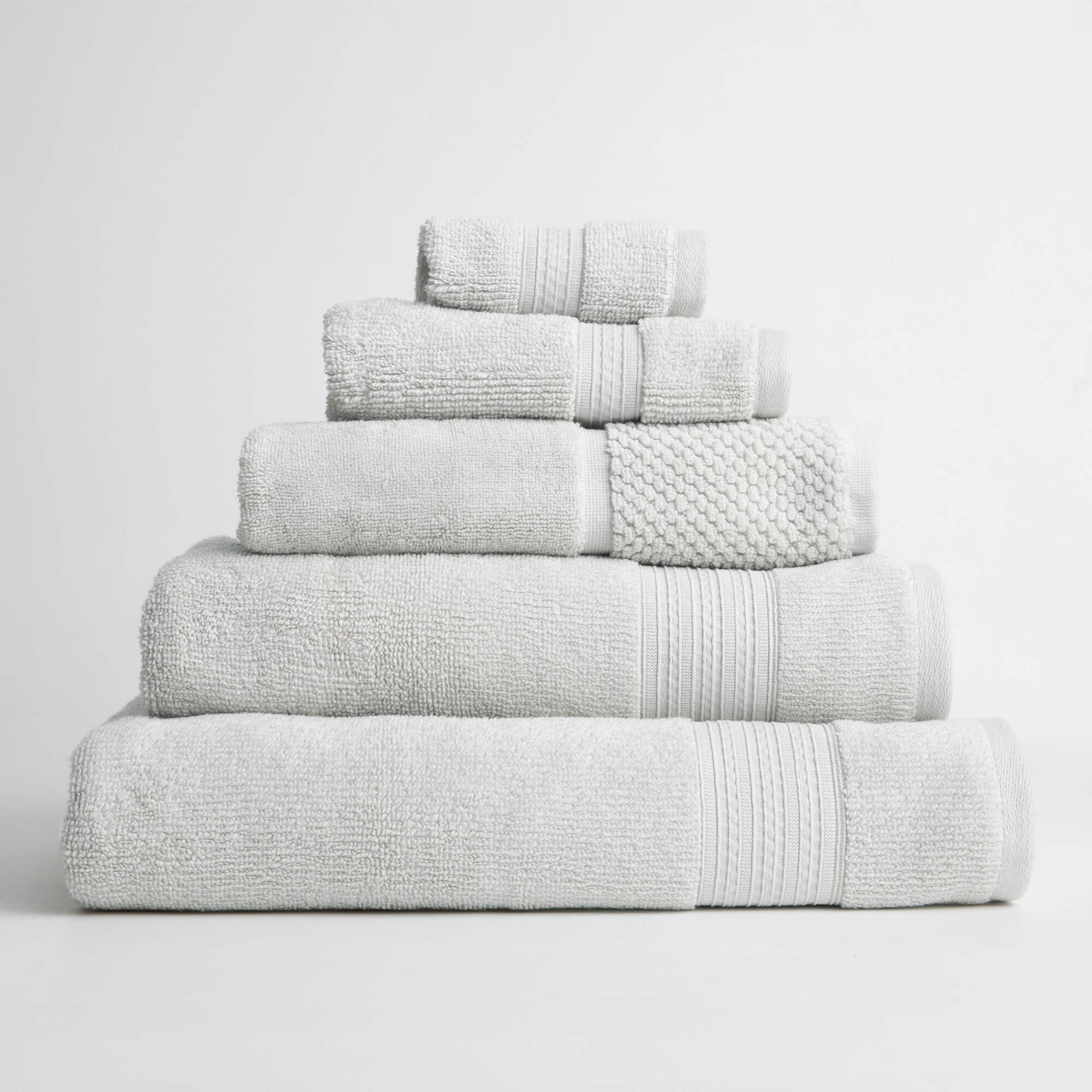 Royal Doulton Harlow Tofu off-white towel set stacked on a white background