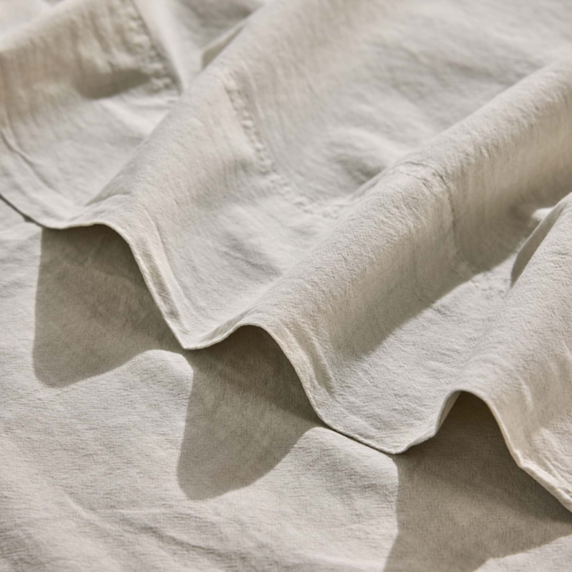 Royal Doulton Nelson Fog sheet fabric close-up with a folded hem