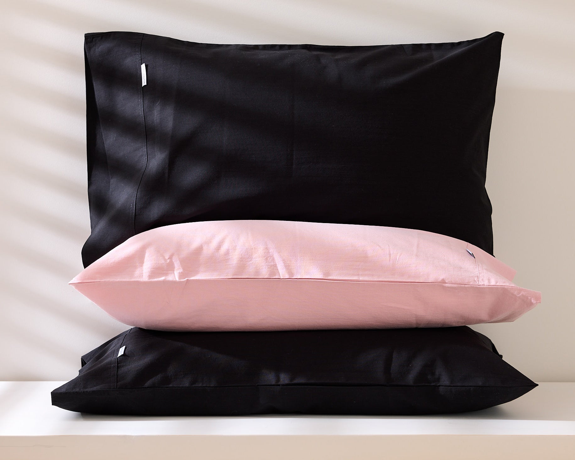 Royal Doulton Nelson black and pink pillowcases stacked together