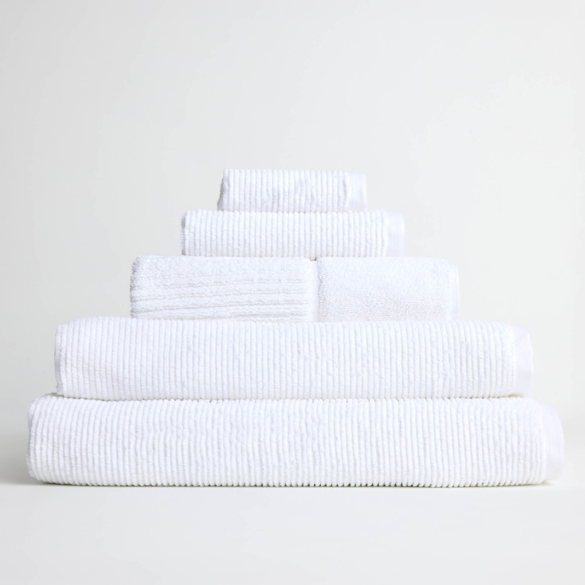 Royal Doulton Eden white towel set stacked on a white background