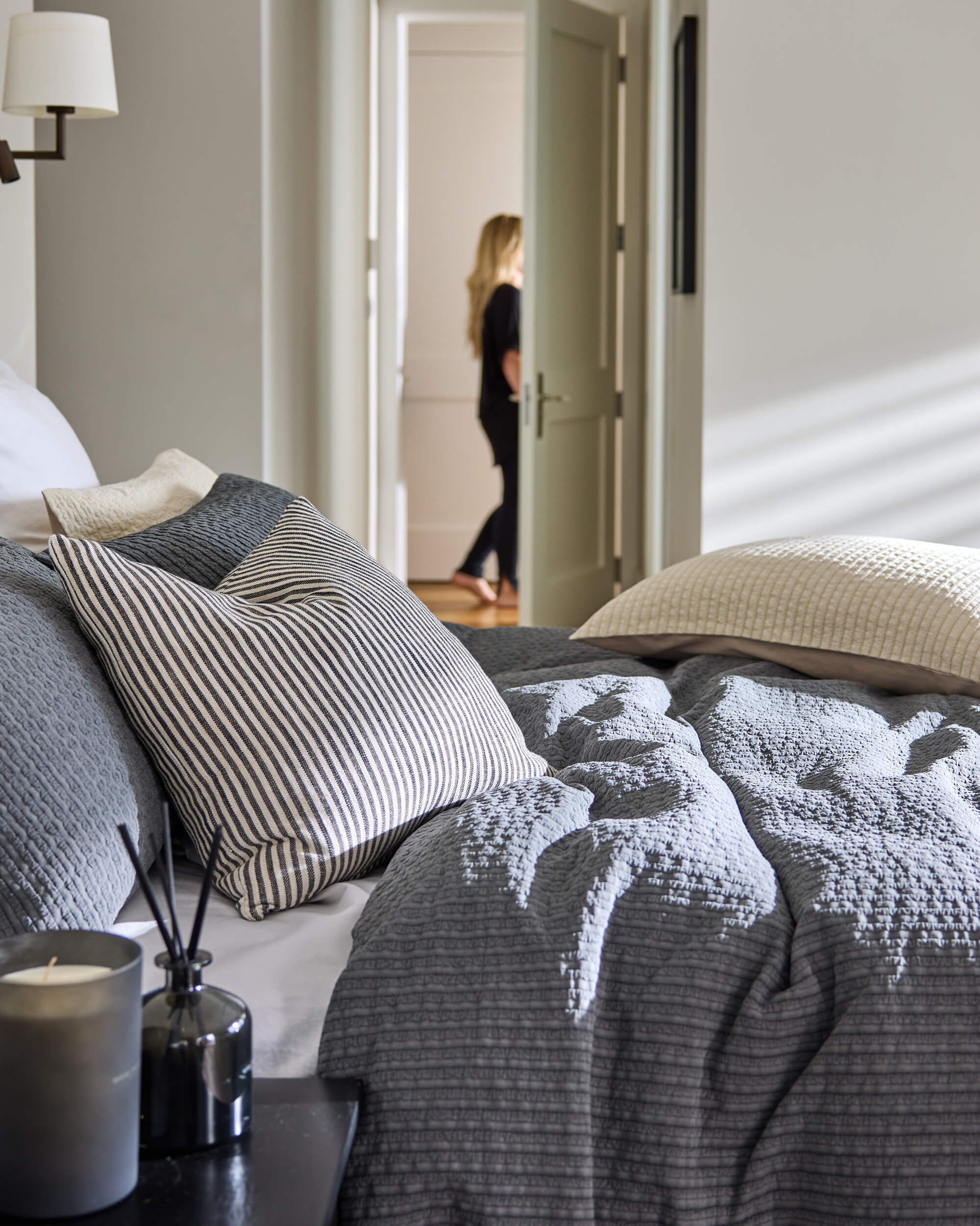 Royal Doulton Halston grey textured duvet cover styled with striped and waffle accent cushions