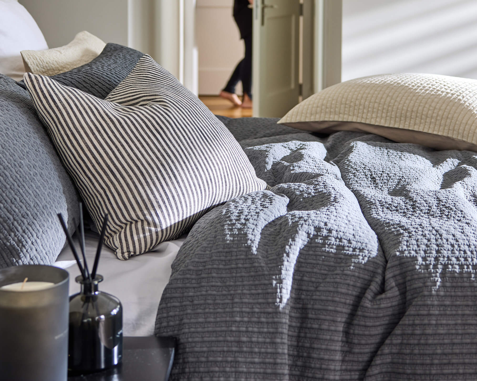 Royal Doulton Halston charcoal textured duvet cover with striped pillows