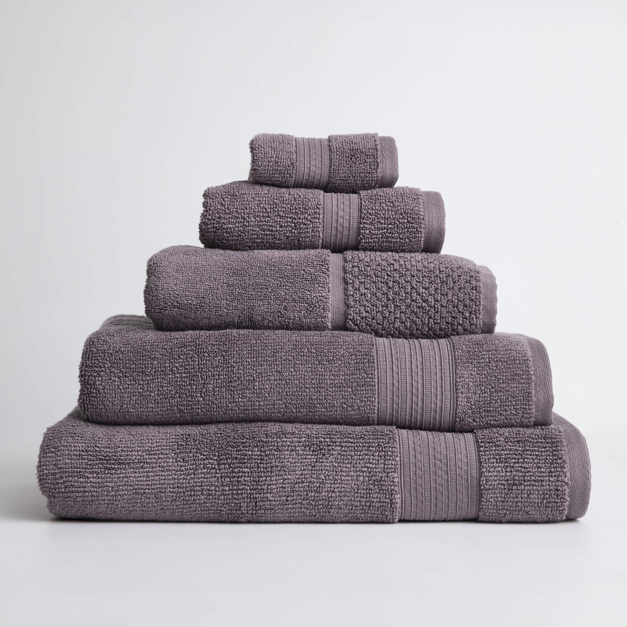 Royal Doulton Harlow Mauve towel set stacked on a white background