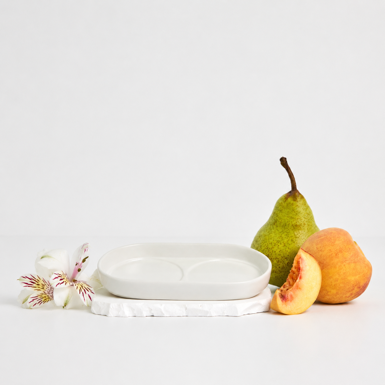 Royal Doulton Mayfair off-white body care tray styled with pear, peach and flowers