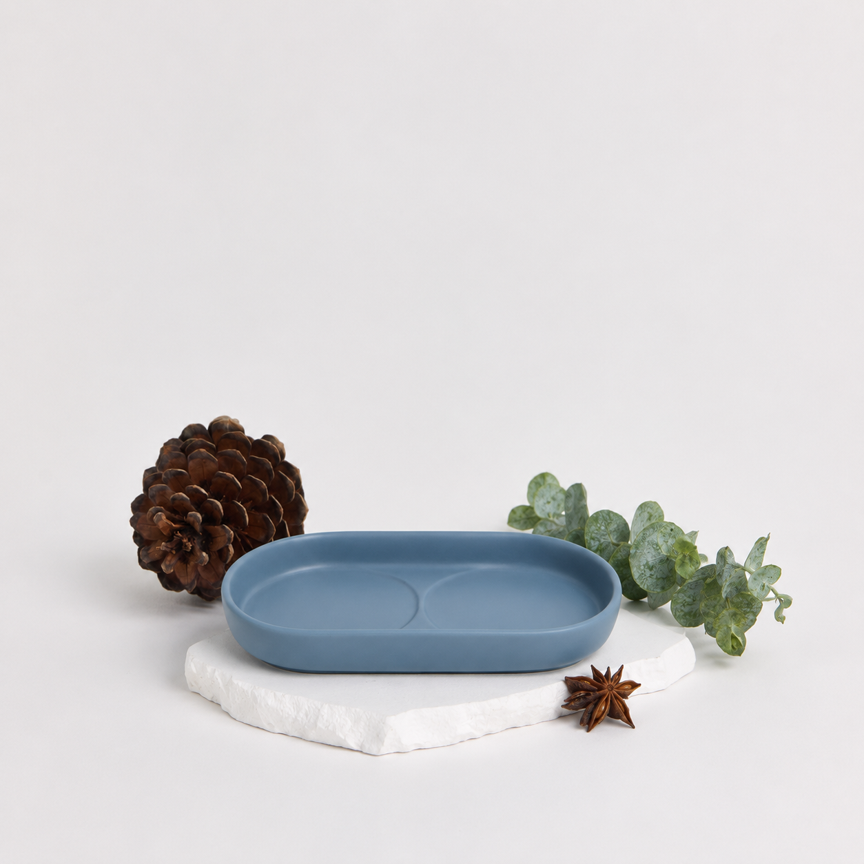 Royal Doulton Montclair blue body care tray styled with a pinecone and greenery