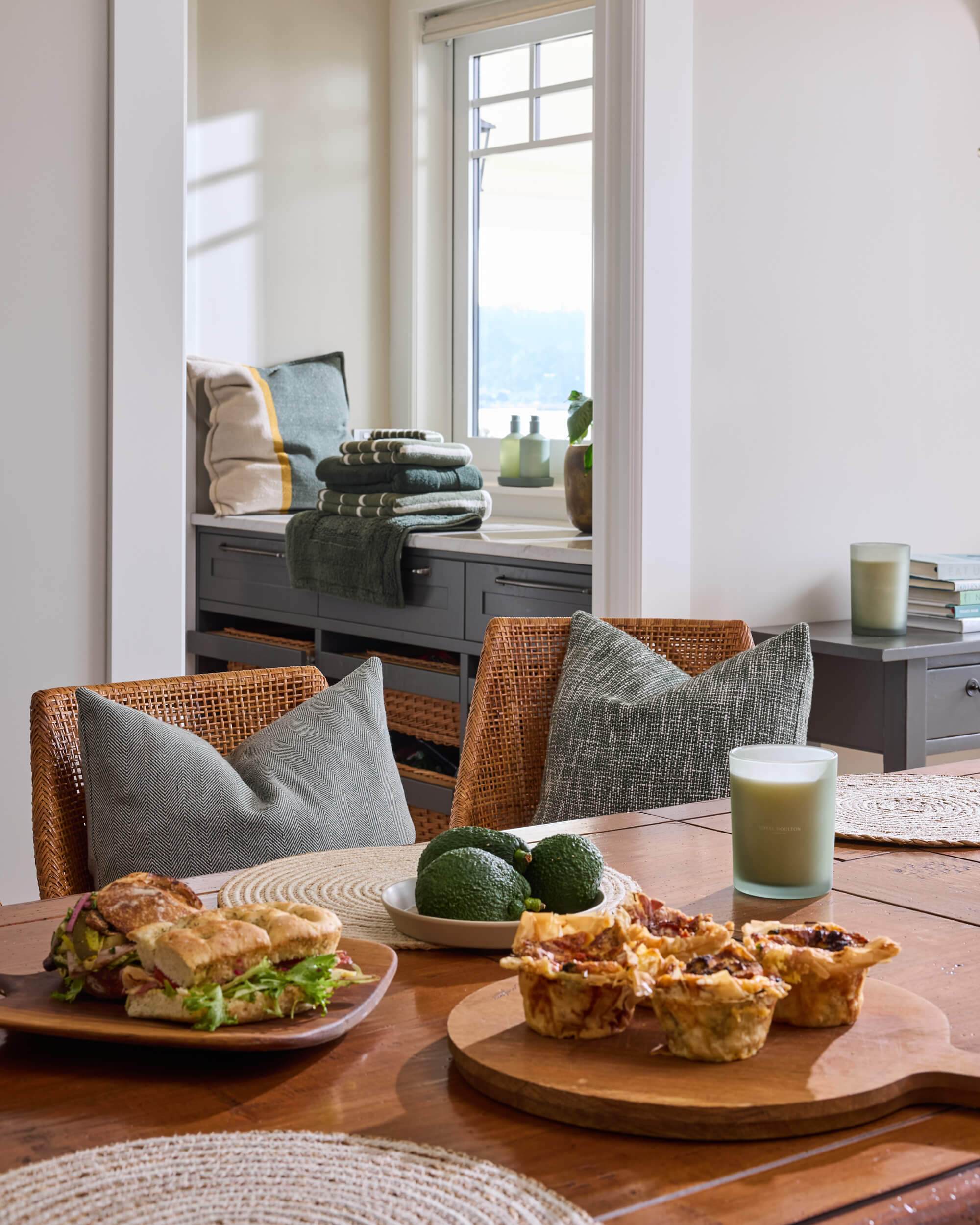 Royal Doulton Connect dining room set for a shared meal with green towels and textured cushions