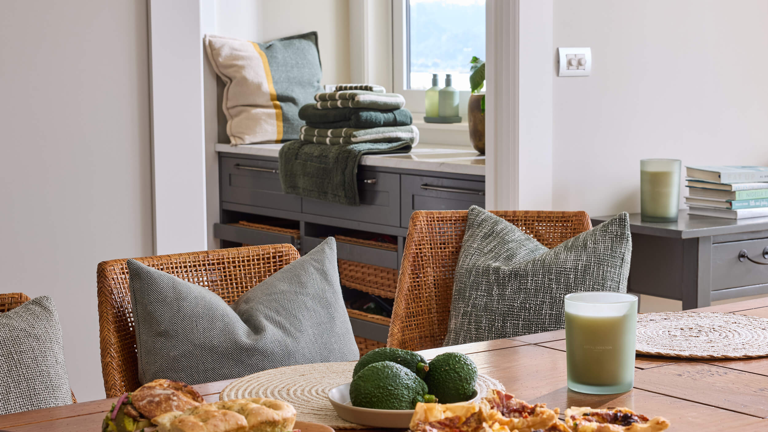 Royal Doulton Connect dining setting with green towels and textured cushions